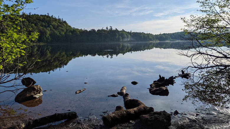 The calm water of Mirror Lake in Porcupine Mountains Wilderness State Park on the Upper Peninsula of Michigan
