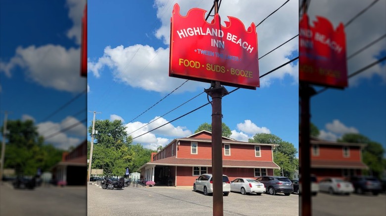 The sign for the Highland Beach Inn at Manitou Beach