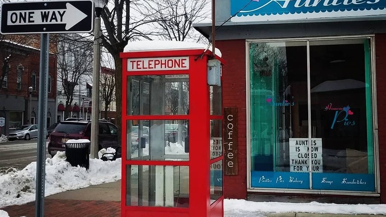 A phone booth on a snowy street