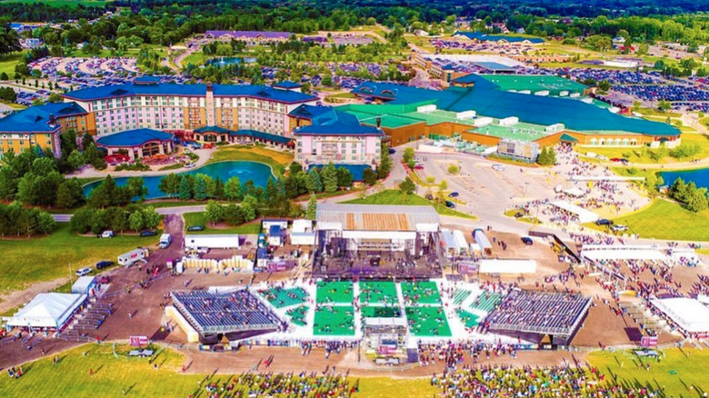 Sprawling hotel property with an outdoor stage in foreground