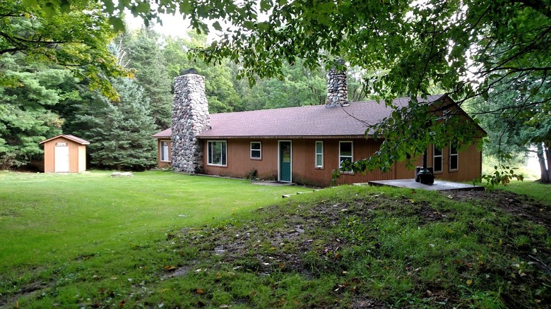 A rental cabin at Craig Lake State Park surrounded by trees
