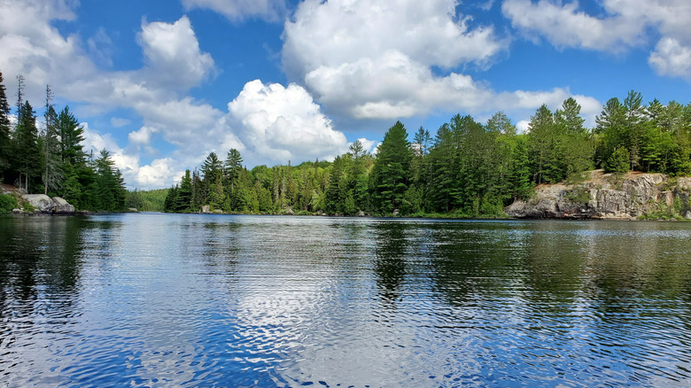 A view of water, granite bluffs, and forests at Craig Lake State Park