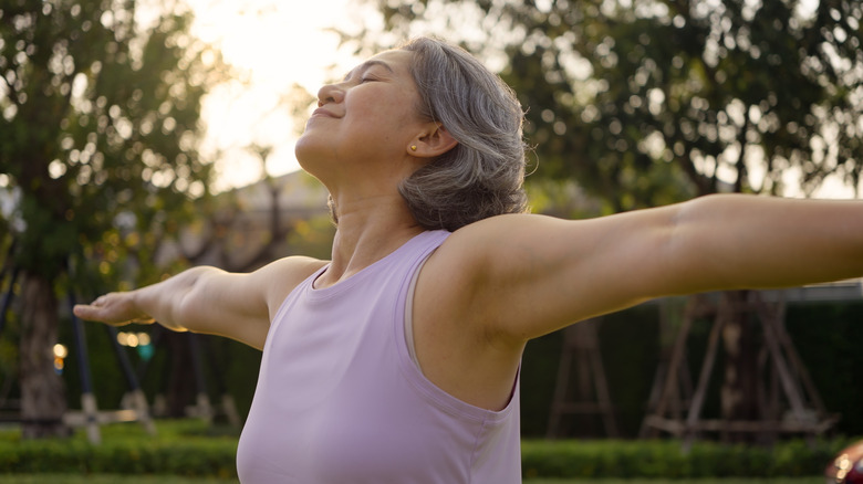 Lady doing yoga at a park