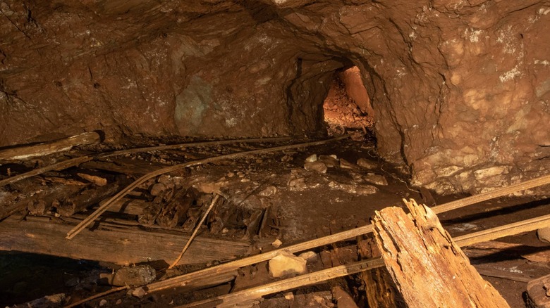 Abandoned mine filled with wood and broken rails Delaware Mine