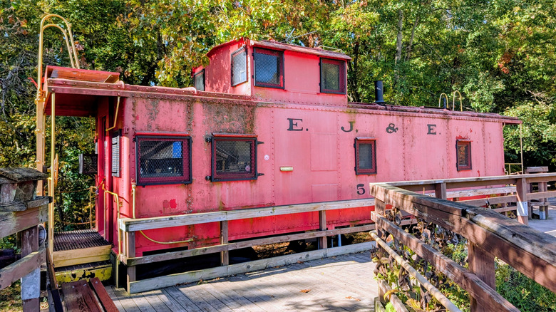 A historic red train caboose in Kal-Haven Trail State Park in Michigan