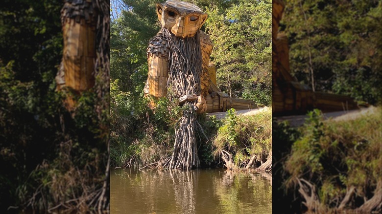 Benny the Beard Fisher, a large troll sculpture along the shore of the Manistique River in Germfask, Michigan