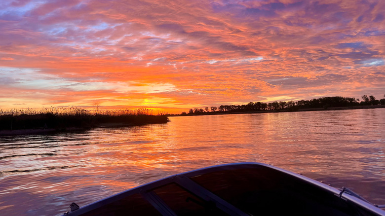 Boat facing sunset on Lake St. Clair