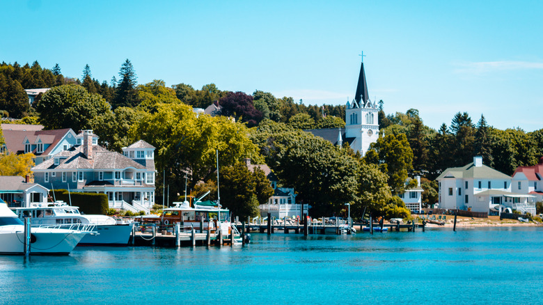 Quaint town and harbor of Mackinac Island seen from the water.