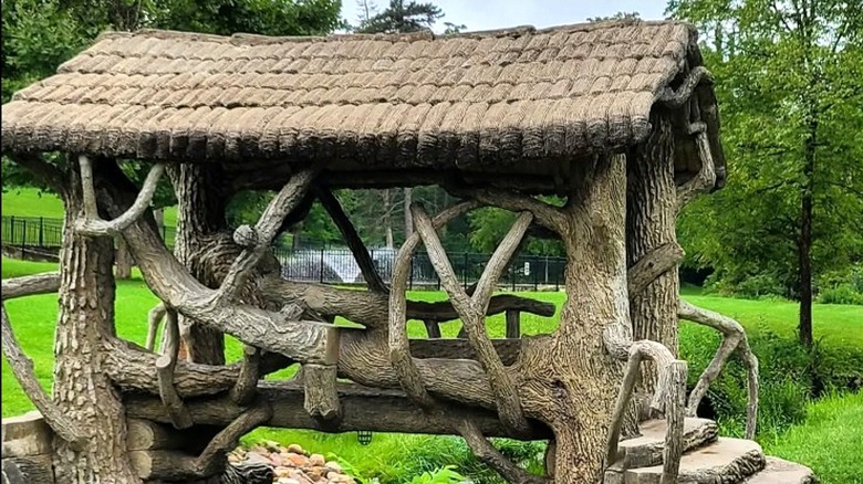 Cement bridge with roof that goes over a creek