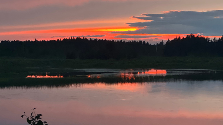 Orange sunset over lake in Ishpeming, Michigan