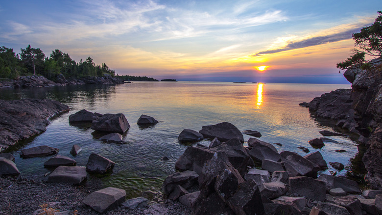 The sun shines over a Lake Superior shoreline