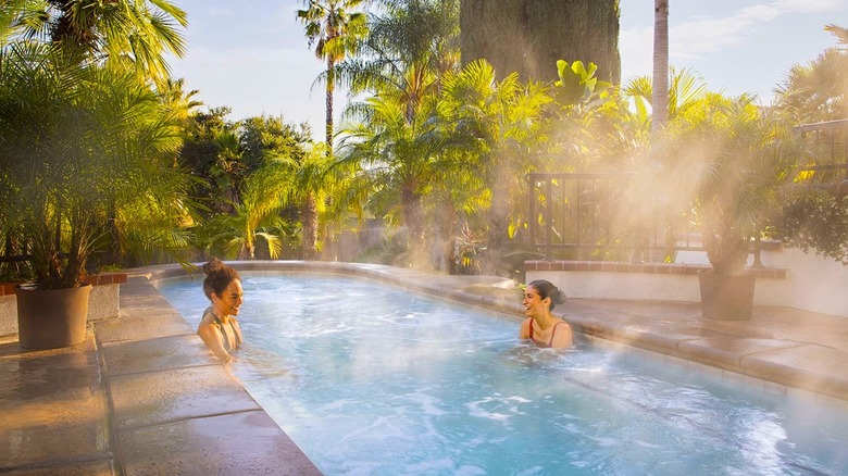 Women in a steaming mineral pool