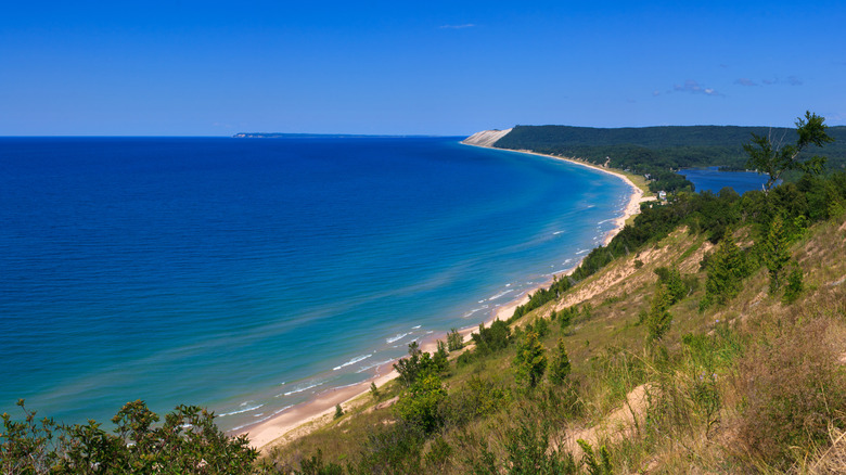 An aerial view of clear blue waters at Sleeping Bear Dunes National Lakeshore