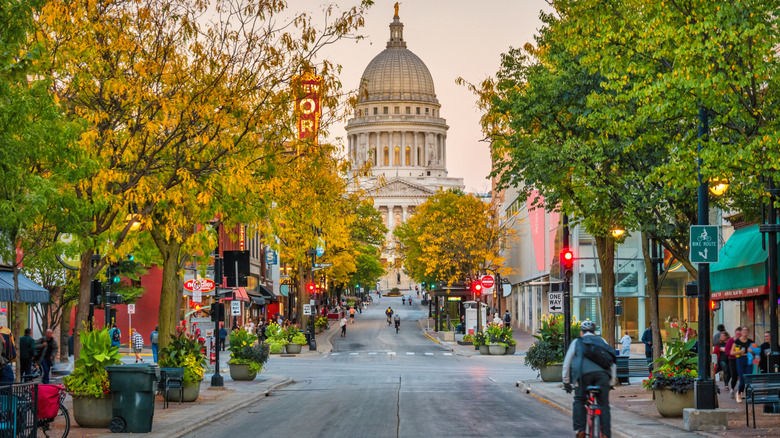 Wisconsin capitol fronting avenue free of cars at dusk