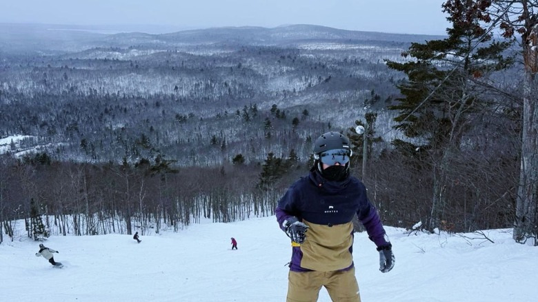 Snowboarders and skiers on the slopes in  Mount Bohemia, Michigan