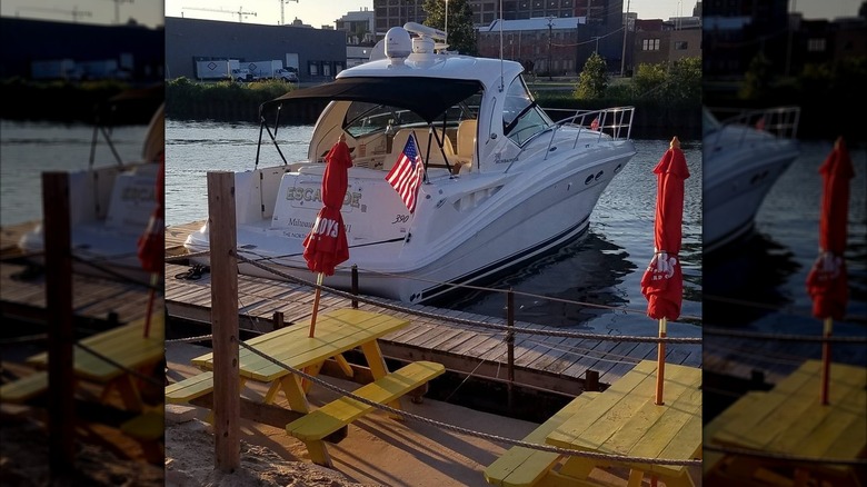 Yellow picnic table at the Twisted Fisherman Crab Shack overlooking the water in Milwaukee