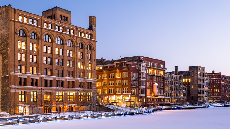 Historic buildings line frozen Milwaukee River