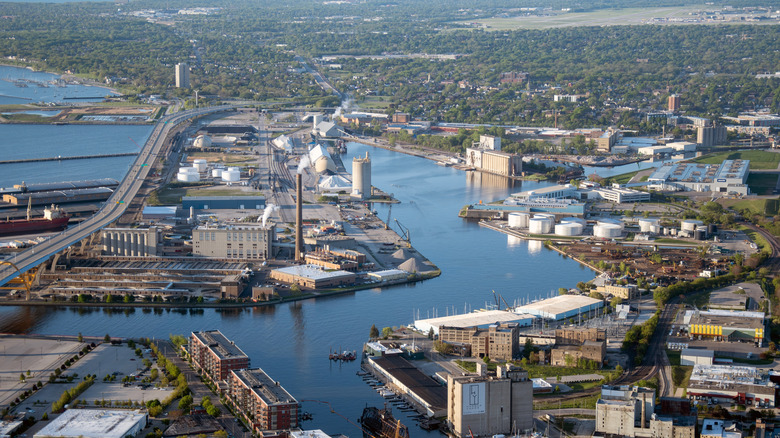 An aerial view of Milwaukee's Harbor District with buildings, river, and roads