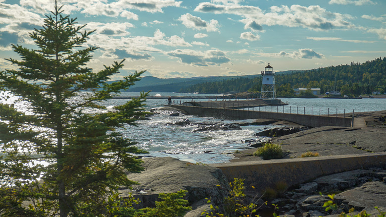 Lake Superior waves wash up on the Grand Marais Lighthouse in Minnesota