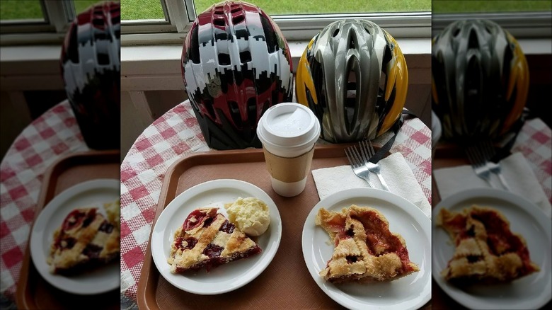 Pie slices and coffee by bike helmets at the Aroma Pie Shoppe in Whalan, Minnesota