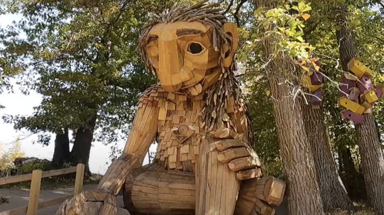 wooden Thomas Dambo troll sculpture in the woods