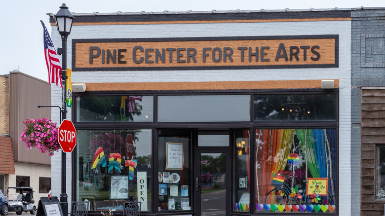 A storfront and gallery with a sign reading Pine Center for the Arts