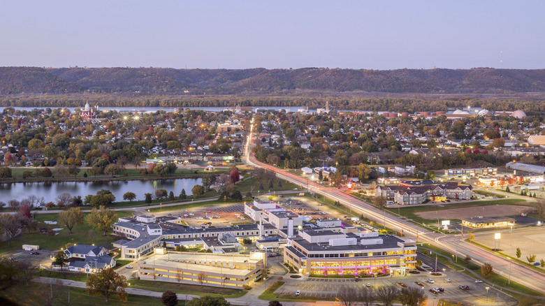 Small town at dusk, with trees and river