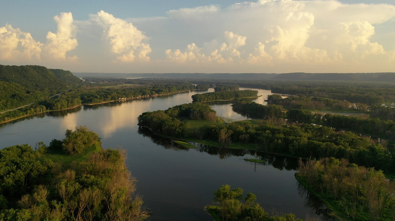 Forested islands and channels on river under beautiful sky view