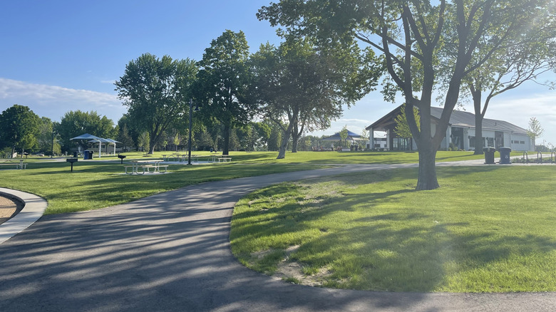 Paved trails and pavillions at Antlers Park in Lakeville, Minnesota on a sunny day