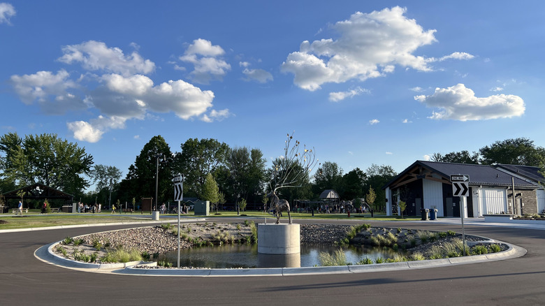 A statue outside of Antlers Park in Lakeville, Minnesota on a sunny day