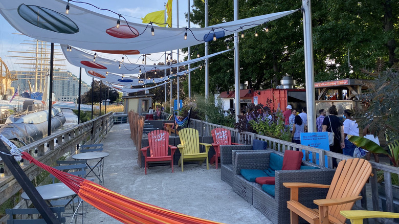 Colorful chairs and food vendors in Spruce Street Harbor Park, Philadelphia