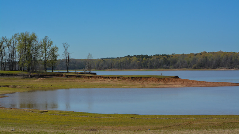 Flat shoreline encircling Enid Lake