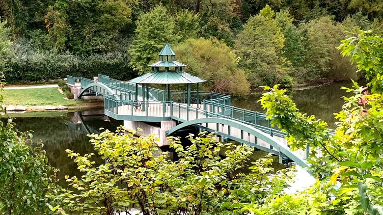 A bridge over a pond, surrounded by trees at Chesterfield's Central Park