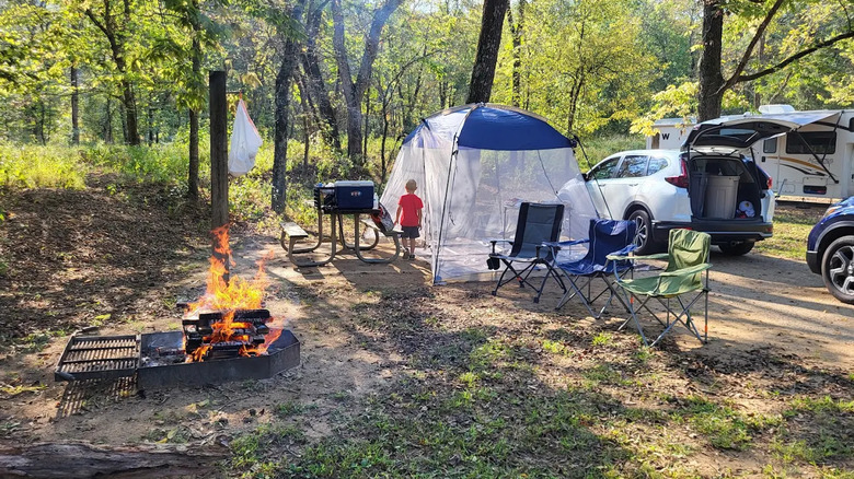 tent, chairs, other camping paraphernalia, and campfire at Sam A. Baker State Park, Missouri