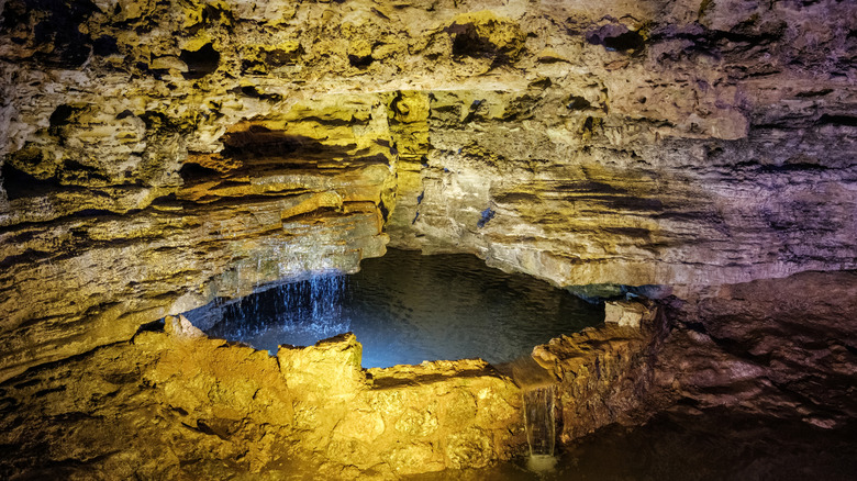 dimly-lit underground pond in Stark Caverns, Eldon