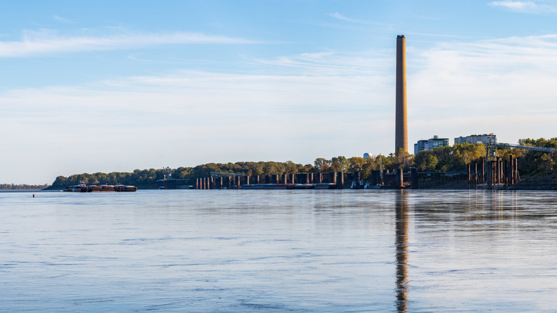 The Mississippi River with a smokestack beside it