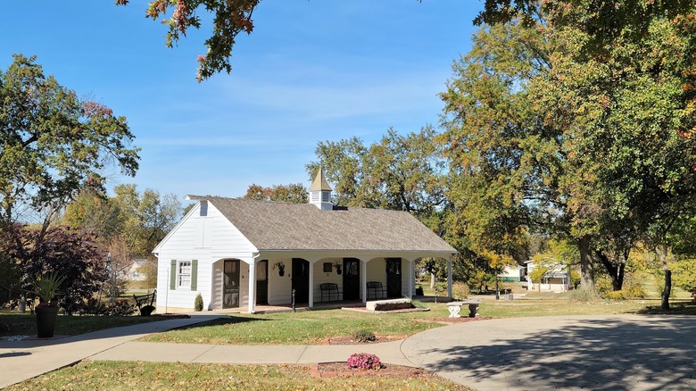 Historic white building surrounded by trees at the Audrain County Historical Museum, Mexico, Missouri
