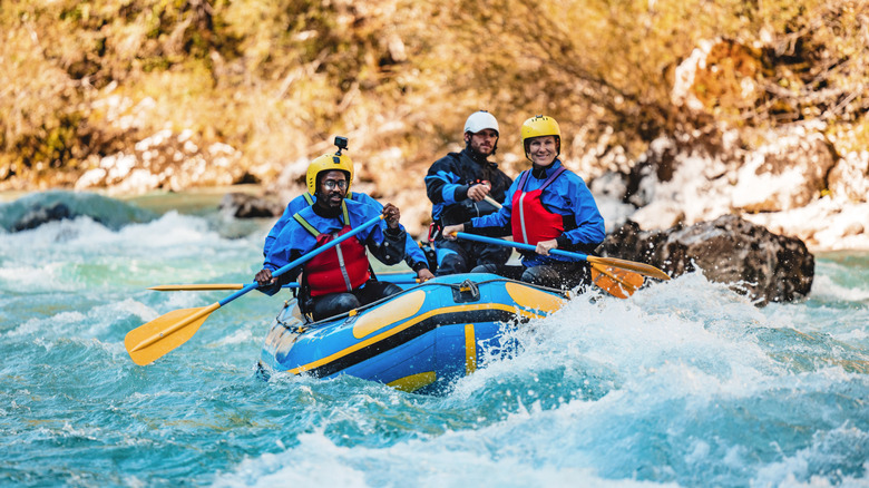 Group of adults river rafting