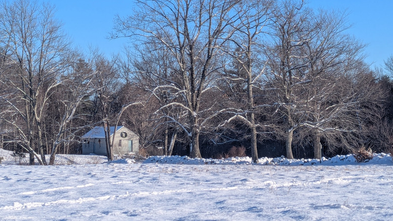 House at the Monson Center surrounded by snowy fields in New Hampshire