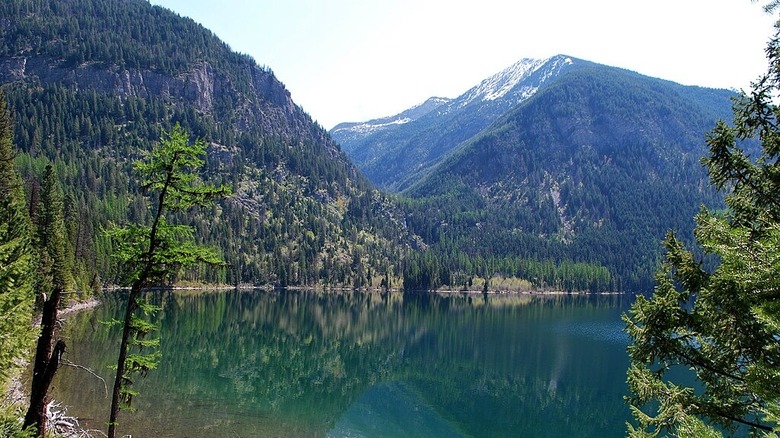 Holland Lake with snow-capped mountains in the background.