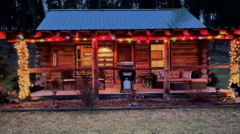 Exterior of a Bigfork cabin decorated with holiday lights