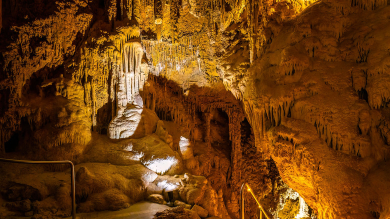 View hiking into Lewis and Clark Caverns State Park with dripping stalactites and yellow light