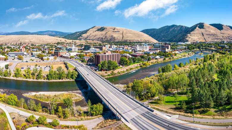 Aerial panorama of Missoula, Montana, above Beartracks Bridge. Missoula is a city in and the county seat of Missoula County, Montana. It is located along the Clark Fork River.