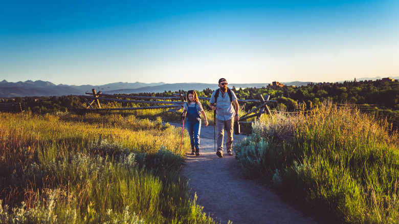 A father and daughter hiking