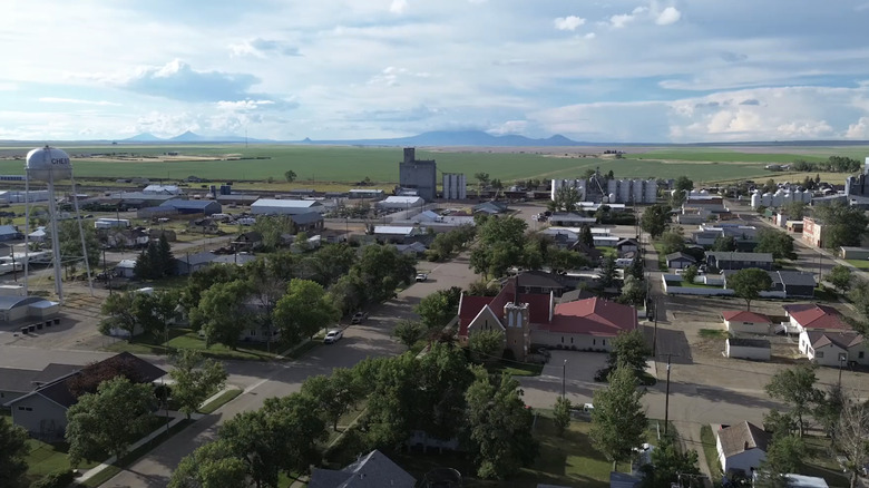 An aerial view of Chester, Montana with mountains in the background