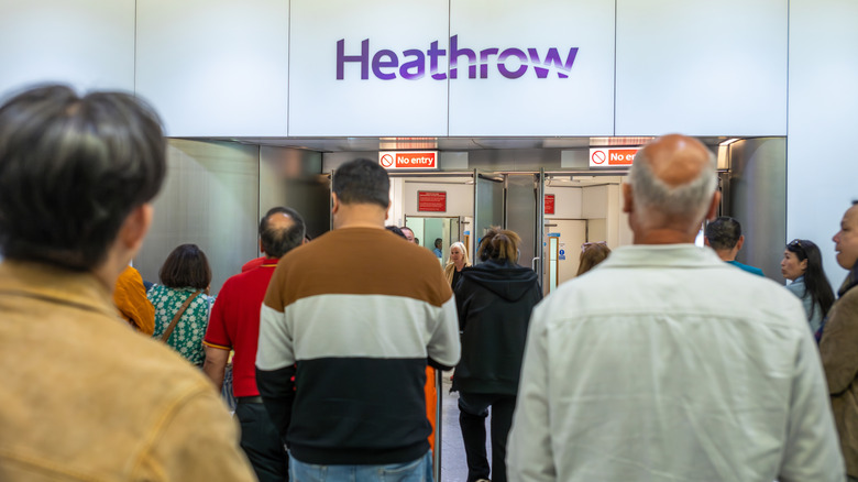 People standing at Heathrow Airport in London