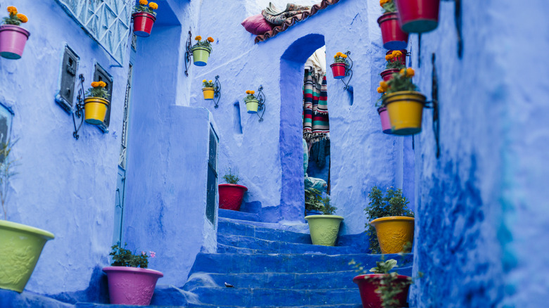 Blue-painted house and staircase in Chefchaouen, Morocco