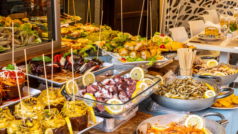 Plates of delicious street food in Palermo, Sicily