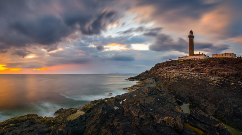 Ardnamurchan Lighthouse on a cloudy day, as seen at sunset