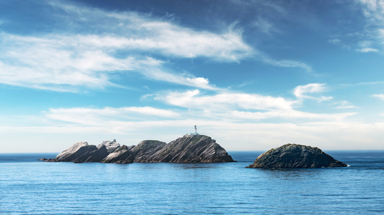 The Muckle Flugga Lighthouse stands on a rock in the middle of the ocean, off the coast of Unst
